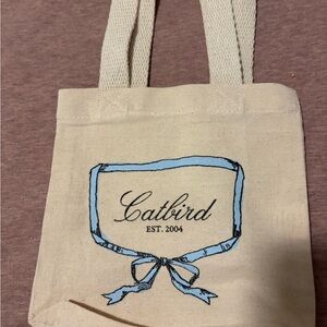 Catbird Beige Tote with Blue Ribbon Design